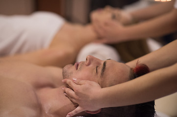 Image showing couple enjoying head massage at the spa