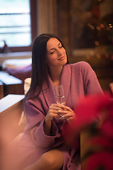 Image showing woman drinking champagne at spa