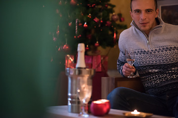 Image showing Happy young man with a glass of champagne