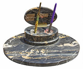 Image showing Old vintage pens on a stone stand