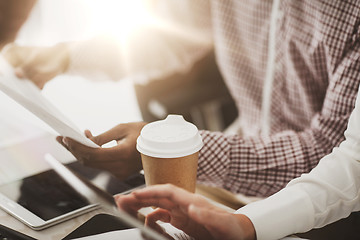 Image showing business team with papers and coffee at office