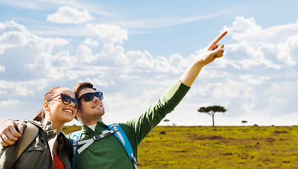 Image showing happy couple with backpacks traveling in africa