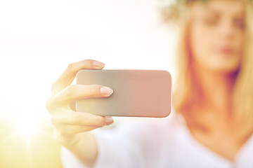 Image showing close up of woman taking selfie by smartphone