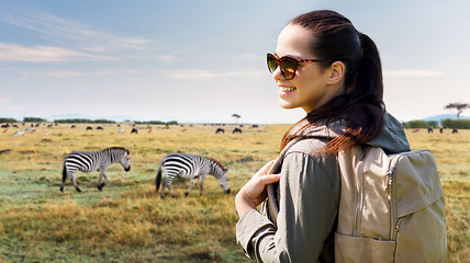 Image showing happy woman with backpack traveling in africa