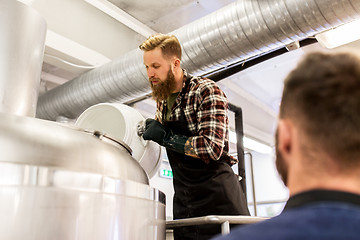 Image showing men working at craft brewery or beer plant