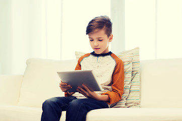 Image showing boy with tablet computer at home