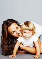 Image showing young pretty stylish mother with little cute blond daughter hugg