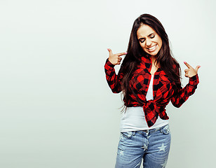 Image showing young happy smiling latin american teenage girl emotional posing on white background, lifestyle people concept