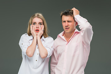 Image showing The young couple with different emotions during conflict