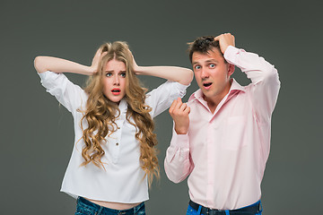 Image showing The young couple with different emotions during conflict