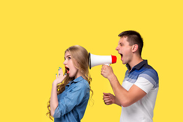 Image showing Man shouting in megaphones at each other