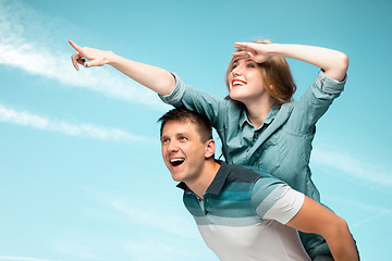 Image showing Young couple smiling under blue sky