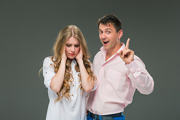 Image showing The young couple with different emotions during conflict