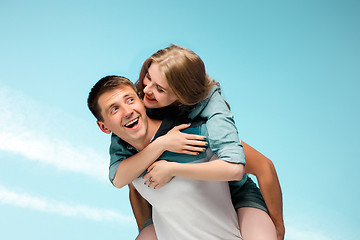 Image showing Young couple smiling under blue sky