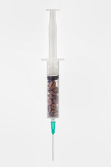 Image showing Coffee beans in syringe