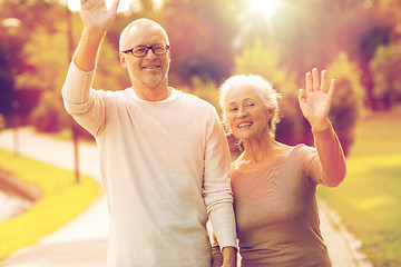 Image showing senior couple hugging in city park