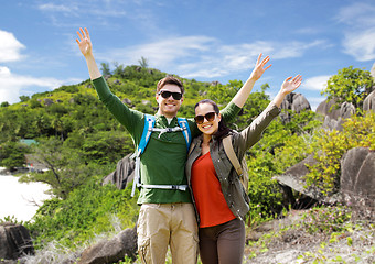 Image showing couple with backpacks traveling around island