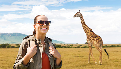 Image showing happy woman with backpack traveling in africa