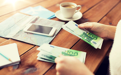 Image showing close up of traveler hands counting euro money