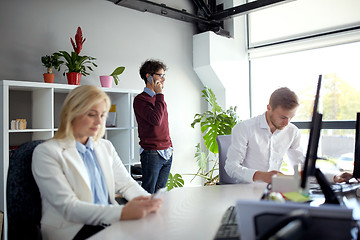 Image showing business team with smartphones at office