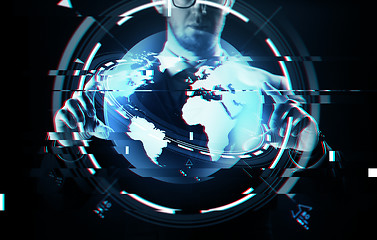 Image showing close up of businessman with earth projection