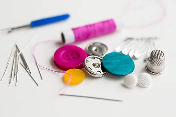 Image showing sewing buttons, needles, pins and thread spool