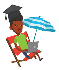 Image showing Graduate lying in chaise lounge with laptop.