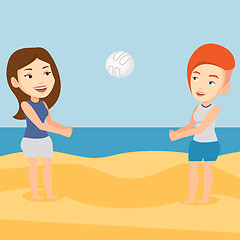 Image showing Two women playing beach volleyball.