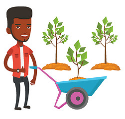 Image showing Man pushing wheelbarrow with plant.