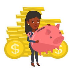 Image showing Businessman holding a big piggy bank.