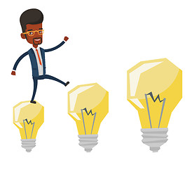 Image showing Businessman jumping on idea bulbs.