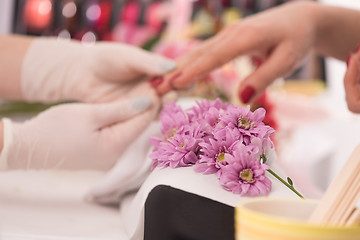 Image showing Woman hands receiving a manicure