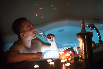 Image showing man relaxing in the jacuzzi