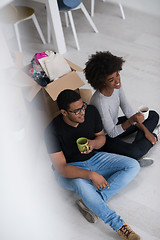 Image showing African American couple relaxing in new house