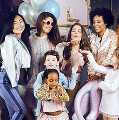 Image showing Lifestyle and people concept: young pretty diversity nations woman with different age children celebrating on birth day party together happy smiling, making selfie. African-american, asian and caucasi