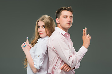 Image showing The young couple with different emotions during conflict