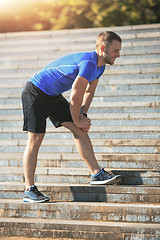 Image showing Fit man doing exercises outdoors at park