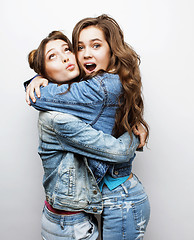 Image showing best friends teenage girls together having fun, posing emotional on white background, besties happy smiling, lifestyle people concept close up. making selfie