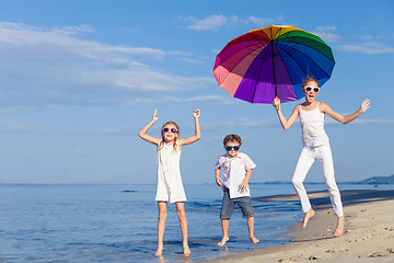 Image showing Happy children playing on the beach at the day time.