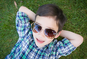 Image showing Mixed Race Chinese and Caucasian Young Boy Wearing Sunglasses Re