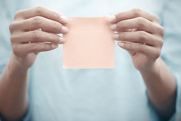 Image showing Woman holding adhesive note