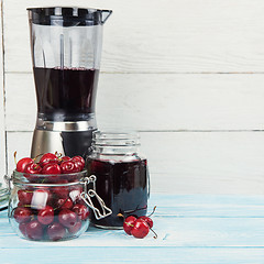 Image showing Cherry juice with glass of berries