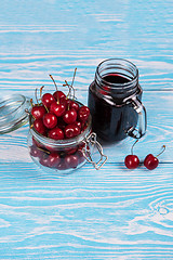 Image showing Cherry juice with glass of berries