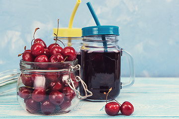 Image showing Cherry juice with glass of berries