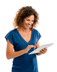 Image showing Happy woman working with a tablet