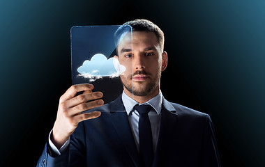 Image showing businessman working with transparent tablet pc