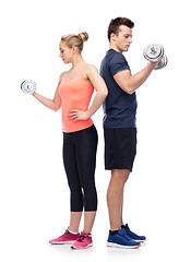 Image showing sportive man and woman with dumbbells