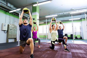 Image showing group of people with medicine ball training in gym