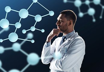 Image showing doctor or scientist in white coat with molecules