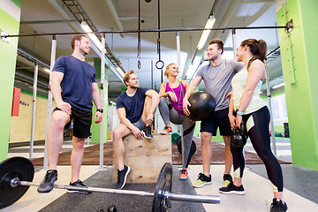 Image showing group of friends with sports equipment in gym